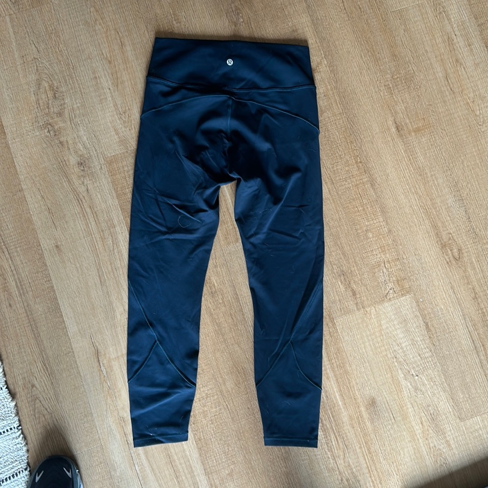 Teal Lululemon In Movement 7/8 tights size 10.